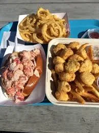 Seafood platter with lobster roll and onion rings